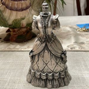 This is a vintage designed metal perfume bottle 6 inches tall 3 inches wide